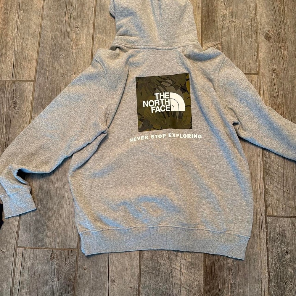 The North Face gray sweatshirt with sought after back camouflage print